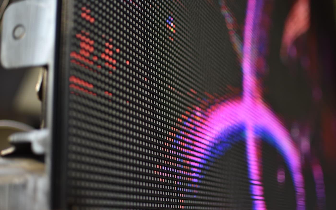 A display photographed close enough to resolve the subpixel grid into colour.